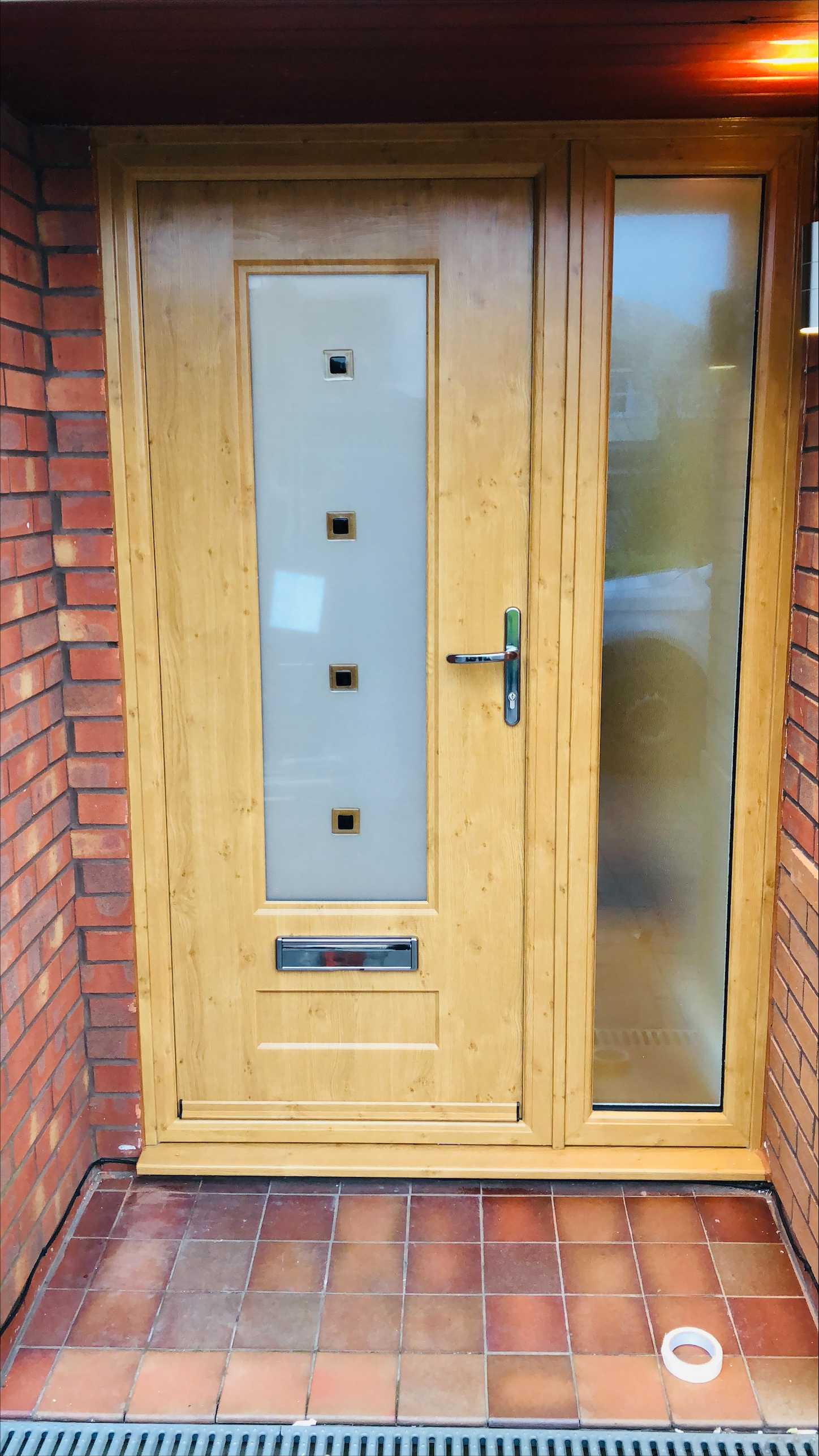 Oak effect composite front door with side panel
