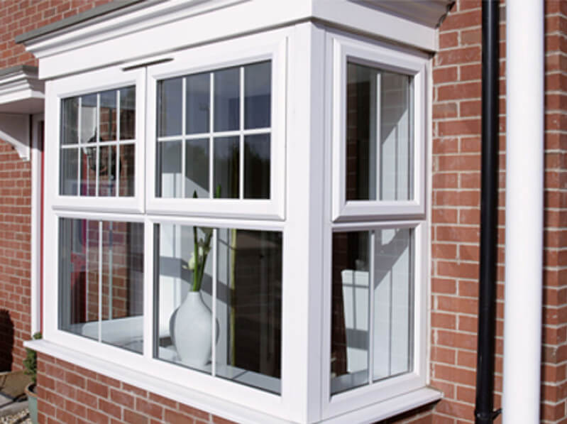 White UPVC bay window with Georgian bar detail